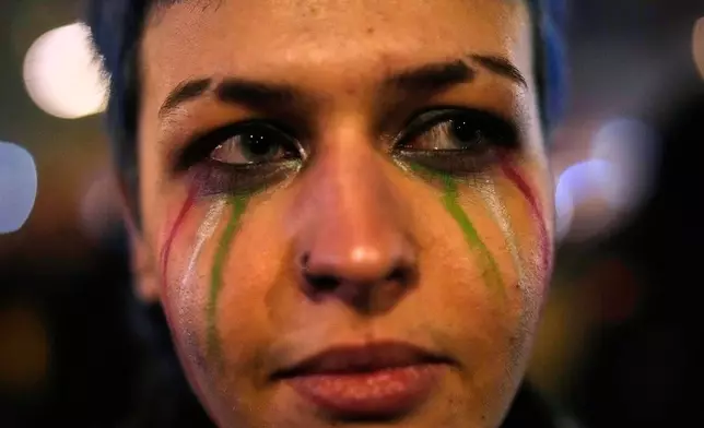 A woman takes part in a rally in support of anti-government protests in Iran, Berlin Germany, Wednesday, June 14, 2026. (AP Photo/Ebrahim Noroozi)