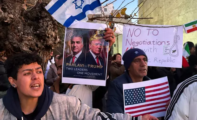 Iranians who live in Greece take part in a protest in front of the US Embassy in Athens, Greece, Tuesday, Jan. 13, 2026, supporting the protests in Iran. (AP Photo/Thanassis Stavrakis)
