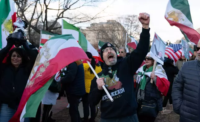 Activists take part in a rally supporting protesters in Iran at Lafayette Park, across from the White House in Washington, Sunday, Jan. 11, 2026. (AP Photo/Jose Luis Magana)