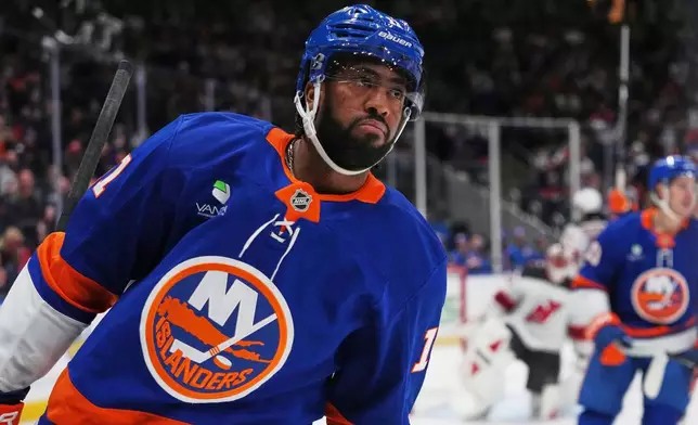 New York Islanders' Anthony Duclair (11) reacts after scoring a goal during the first period of an NHL hockey game against the New Jersey Devils Tuesday, Jan. 6, 2026, in Elmont, N.Y. (AP Photo/Frank Franklin II)
