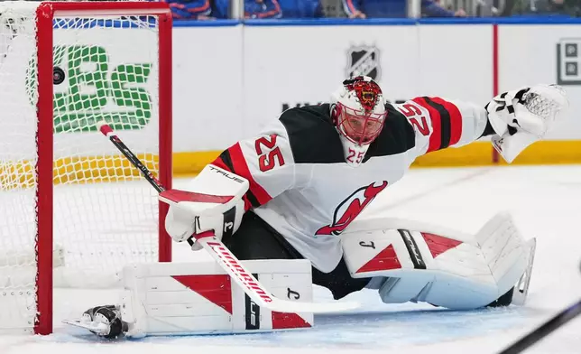 New Jersey Devils goaltender Jacob Markstrom (25) reacts as a puck shot by New York Islanders' Mathew Barzal gets past him for a goal during the first period of an NHL hockey game Tuesday, Jan. 6, 2026, in Elmont, N.Y. (AP Photo/Frank Franklin II)