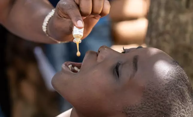 A health worker administers a cholera vaccine in Blantyre, southern Malawi, Thursday, Jan. 22, 2026. (AP Photo/Thoko Chikondi)