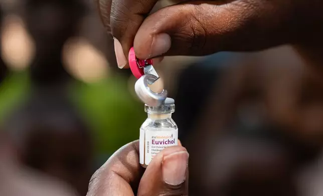 A health worker opens a cholera vaccine in Blantyre, southern Malawi, Thursday, Jan. 22, 2026. (AP Photo/Thoko Chikondi)