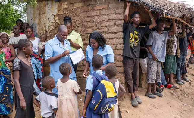 A health worker registers children for cholera vaccination in Blantyre, southern Malawi, Thursday, Jan. 22, 2026. (AP Photo/Thoko Chikondi)