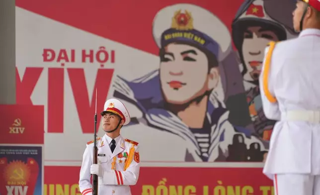 Honor guards salute the arrival of delegation at the National Convention Center for the week-long Congress of the Communist Party of Vietnam in Hanoi, Vietnam, Monday, Jan. 19, 2026. (AP Photo/Hau Dinh)