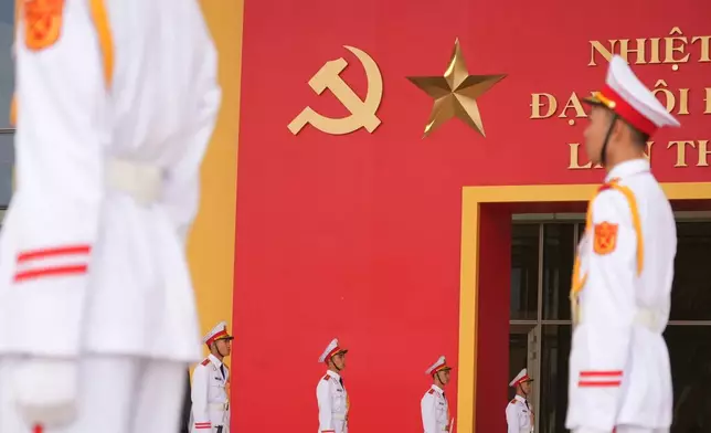 Honor guards stand in position at the National Convention Center for the week-long Congress of the Communist Party of Vietnam in Hanoi, Vietnam, Monday, Jan. 19, 2026. (AP Photo/Hau Dinh)