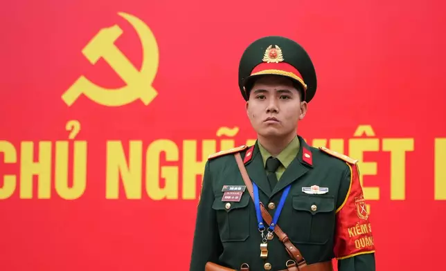 A security officer guards the entrance ofthe National Convention Center during the week-long Congress of the Communist Party of Vietnam in Hanoi, Vietnam, Monday, Jan. 19, 2026. (AP Photo/Hau Dinh)