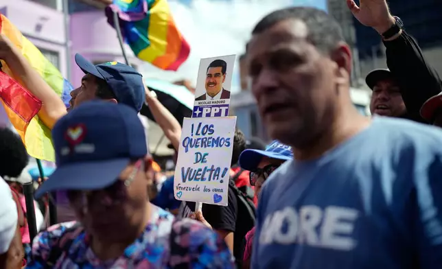 Supporters of the Venezuelan government rally calling for the release of former Venezuelan President Nicolas Maduro and his wife, Cilia Flores, who were captured by U.S. forces, in Caracas, Venezuela, Friday, Jan. 9, 2026. (AP Photo/Ariana Cubillos)