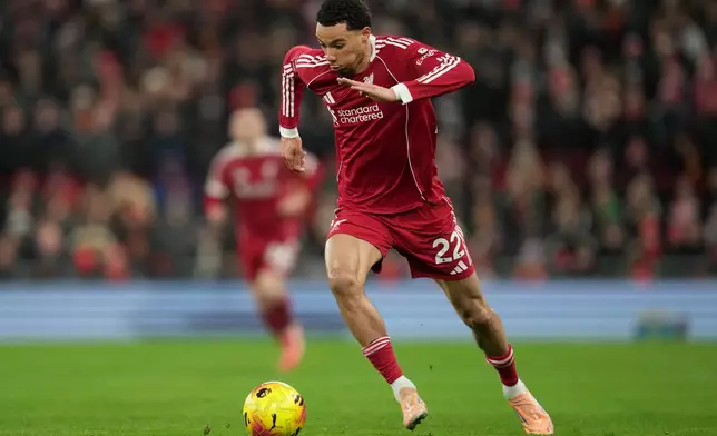 Liverpool's Hugo Ekitike controls the ball during the English Premier League soccer match between Liverpool and Leeds United in Liverpool, England, Thursday, Jan. 1, 2026. (AP Photo/Jon Super)