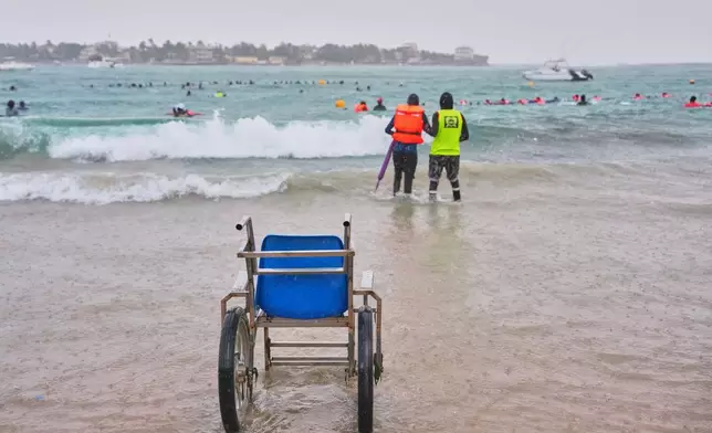 FILE - A wheelchair is seen at the shoreline during an aquatic therapy session in the ocean in Dakar, Senegal, Saturday, Dec. 6, 2025. (AP Photo/Misper Apawu, File)