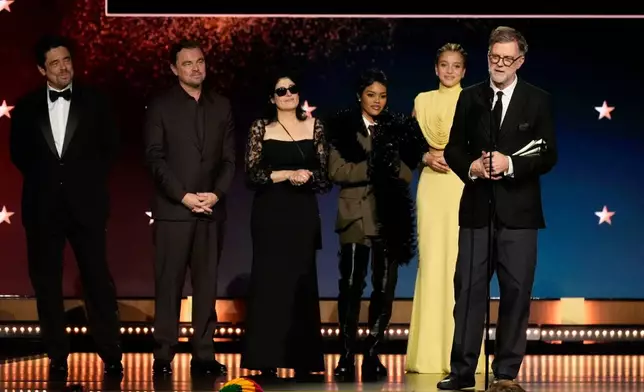 Benicio del Toro, from left, Leonardo DiCaprio, Cassandra Kulukundis, Teyana Taylor, Chase Infiniti, and Paul Thomas Anderson accept the award for best picture for "One Battle After Another" during the 31st Annual Critics Choice Awards on Sunday, Jan. 4, 2026, at The Barker Hanger in Santa Monica, Calif. (AP Photo/Chris Pizzello)