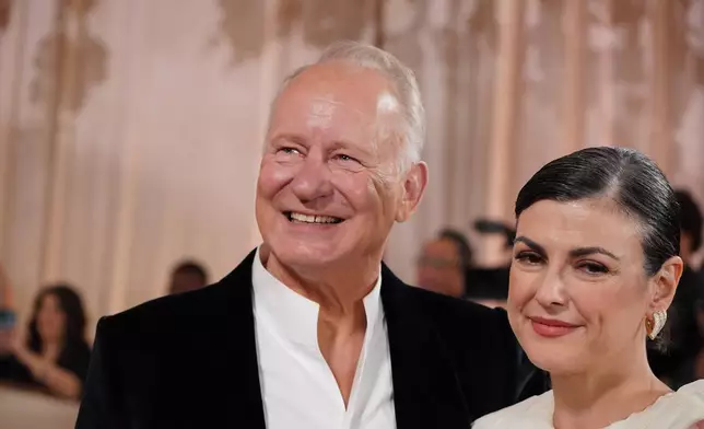 Stellan Skarsgård, left, and Megan Everett-Skarsgard arrive at the 83rd Golden Globes on Sunday, Jan. 11, 2026, at the Beverly Hilton in Beverly Hills, Calif. (Photo by Jordan Strauss/Invision/AP)