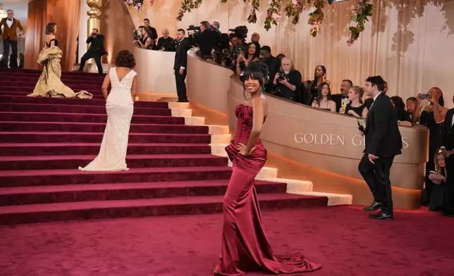 Maura Higgins, from ledt, Gayle King, and Mona Kosar Abdi arrive at the 83rd Golden Globes on Sunday, Jan. 11, 2026, at the Beverly Hilton in Beverly Hills, Calif. (Photo by Jordan Strauss/Invision/AP)