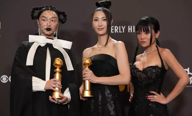 Audrey Nuna, from left, EJAE, and Rei Ami pose in the press room with the award for best original song – motion picture for "Golden" from "Kpop Demon Hunters" during the 83rd Golden Globes on Sunday, Jan. 11, 2026, at the Beverly Hilton in Beverly Hills, Calif. (AP Photo/Chris Pizzello)