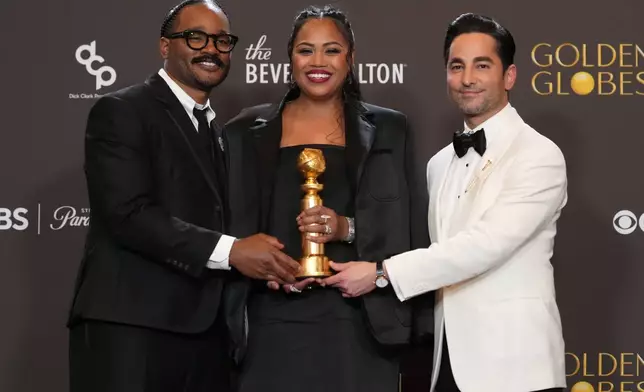 Ryan Coogler, from left, Zinzi Evans, and Sev Ohanian pose in the press room with the award for cinematic and box office achievement for "Sinners" during the 83rd Golden Globes on Sunday, Jan. 11, 2026, at the Beverly Hilton in Beverly Hills, Calif. (AP Photo/Chris Pizzello)