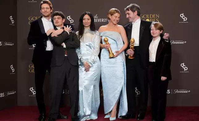 Joe Alwyn, from left, Noah Jupe, Chloe Zhao, Jessie Buckley, Paul Mescal, and Jacobi Jupe pose in the press room with the award for best motion picture - drama for "Hamnet" during the 83rd Golden Globes on Sunday, Jan. 11, 2026, at the Beverly Hilton in Beverly Hills, Calif. (AP Photo/Chris Pizzello)