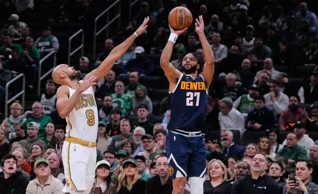 Denver Nuggets guard Jamal Murray (27) shoots against Boston Celtics guard Derrick White (9) during the first half of an NBA basketball game, Wednesday, Jan. 7, 2026, in Boston. (AP Photo/Charles Krupa)