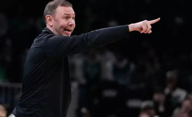 Denver Nuggets head coach David Adelman calls to his players during the first half of an NBA basketball game against the Boston Celtics, Wednesday, Jan. 7, 2026, in Boston. (AP Photo/Charles Krupa)