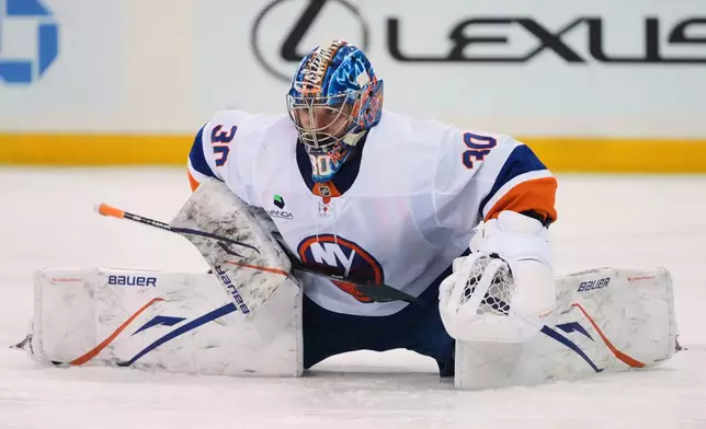New York Islanders goaltender Ilya Sorokin (30) stretches during a pause in play during the second period of an NHL hockey game against the New York Rangers Thursday, Jan. 29, 2026, in New York. (AP Photo/Frank Franklin II)