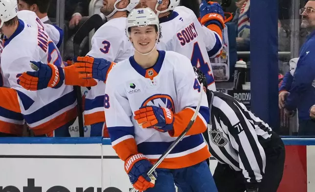 New York Islanders' Matthew Schaefer smiles after scoring a goal during the second period of an NHL hockey game against the New York Rangers Thursday, Jan. 29, 2026, in New York. (AP Photo/Frank Franklin II)