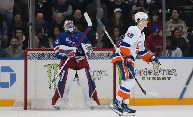 New York Islanders' Matthew Schaefer (48) skates past New York Rangers goaltender Jonathan Quick (32) after scoring a goal during the second period of an NHL hockey game Thursday, Jan. 29, 2026, in New York. (AP Photo/Frank Franklin II)