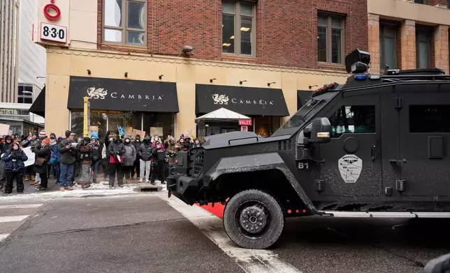 Minneapolis Police officers respond to immigration protests Saturday, Jan. 17, 2026, in Minneapolis. (AP Photo/Yuki Iwamura)
