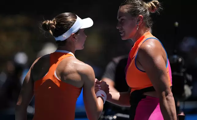 Aryna Sabalenka, right, of Belarus is congratulated by Iva Jovic of the U.S. following their quarterfinal match at the Australian Open tennis championship in Melbourne, Australia, Tuesday, Jan. 27, 2026. (AP Photo/Aaron Favila)