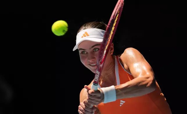 Iva Jovic of the U.S. plays a backhand return to Aryna Sabalenka of Belarus during their quarterfinal match at the Australian Open tennis championship in Melbourne, Australia, Tuesday, Jan. 27, 2026. (AP Photo/Dita Alangkara)