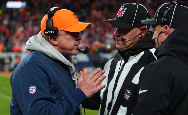 Denver Broncos head coach Sean Payton disputes a call during overtime of an NFL divisional round playoff football game against the Buffalo Bills, Saturday, Jan. 17, 2026, in Denver. (AP Photo/Jack Dempsey)