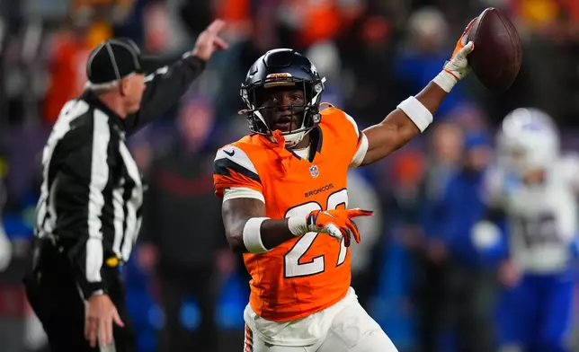 Denver Broncos cornerback Ja'quan McMillian reacts after intercepting a pass intended for Buffalo Bills wide receiver Brandin Cooks during overtime of an NFL divisional round playoff football game, Saturday, Jan. 17, 2026, in Denver. (AP Photo/Jack Dempsey)