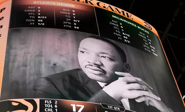 MArtin Luther King is honored during the first half of an NBA basketball game between the Atlanta Hawks and the Milwaukee Bucks, Monday, Jan. 19, 2026, in Atlanta. (AP Photo/Mike Stewart)