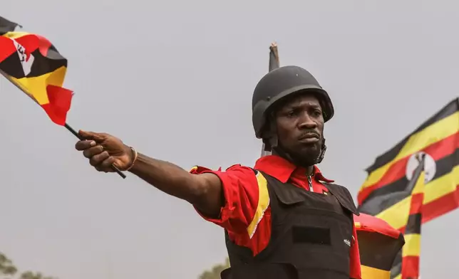 Uganda opposition presidential candidate Robert Kyagulanyi Ssentamu who is known as Bobi Wine waves to supporters at an election campaign rally in Mukono, Uganda, Friday, Jan. 9, 2026. (AP Photo/Hajarah Nalwadda)