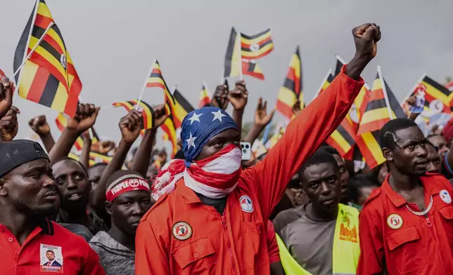 Supporters of Uganda opposition presidential candidate Robert Kyagulanyi Ssentamu, known as Bobi Wine, gesture as he arrives for his final campaign rally at Aga Khan Grounds in Kampala, Uganda, Monday, Jan. 12, 2026. (AP Photo/Samson Otieno)