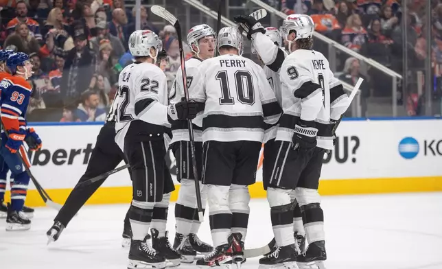 Los Angeles Kings players celebrate after a goal against the Edmonton Oilers during first-period NHL hockey game action in Edmonton, Alberta, Saturday, Jan. 10, 2026. (Jason Franson/The Canadian Press via AP)