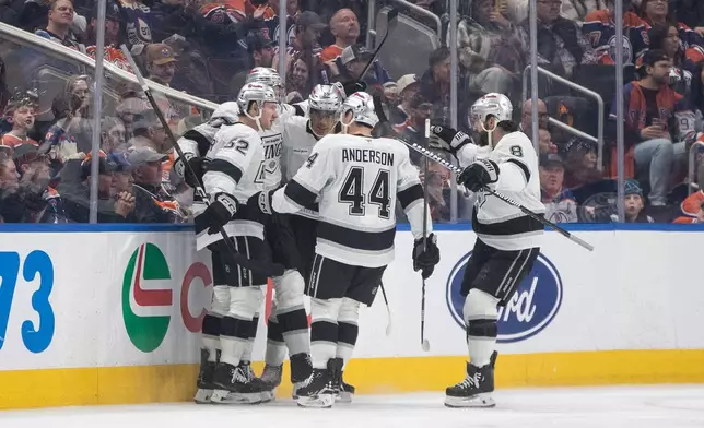 Los Angeles Kings players celebrate a goal against the Edmonton Oilers during the second period of an NHL game, in Edmonton, Alberta, Saturday, Jan. 10, 2026. (Jason Franson/The Canadian Press via AP)