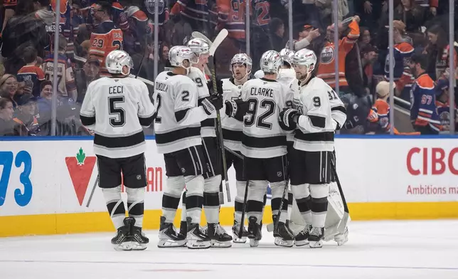Los Angeles Kings players celebrate the win over the Edmonton Oilers during a shoot-out of an NHL hockey game in Edmonton on Saturday, Jan. 10, 2026. (Jason Franson/The Canadian Press via AP)