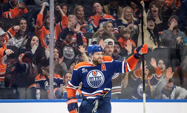 Edmonton Oilers' Leon Draisaitl celebrates a goal against the Los Angeles Kings during the second period of an NHL game, in Edmonton, Alberta, Saturday, Jan. 10, 2026. (Jason Franson/The Canadian Press via AP)