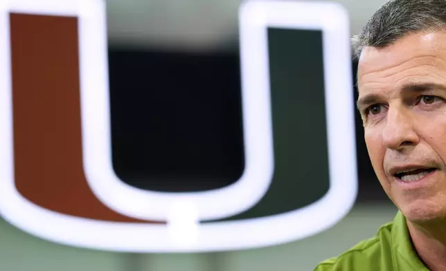 Miami football head coach Mario Cristobal speaks during an interview on the team's indoor practice field in Coral Gables, Fla., Monday, Jan. 12, 2026. (AP Photo/Rebecca Blackwell)