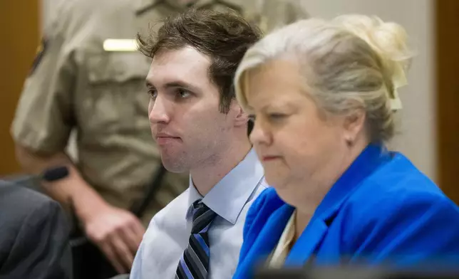Tyler Robinson, accused in the fatal shooting of Charlie Kirk, sits beside defense attorney Kathryn Nester during a hearing in 4th District Court in Provo, Utah, on Friday, Jan. 16, 2026. (Bethany Baker/The Salt Lake Tribune via AP, Pool)