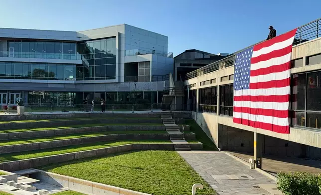 FILE - A U.S. flag hangs at Utah Valley University in Orem, Utah, Sept. 17, 2025, over the site where conservative activist Charlie Kirk was shot and killed. (AP Photo/Jesse Bedayn, File)