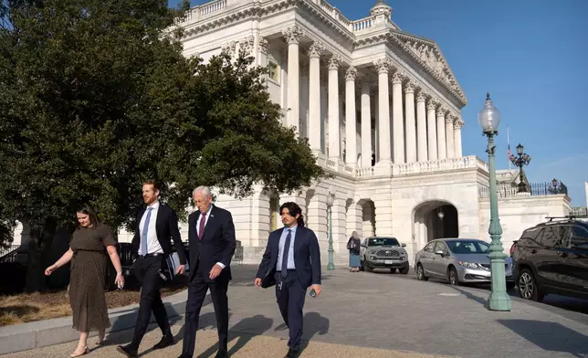Rep. Steny Hoyer, D-Md., second from right, leaves after speaking on the House floor at the Capitol, Thursday, Jan. 8, 2026, in Washington. (AP Photo/Mark Schiefelbein)