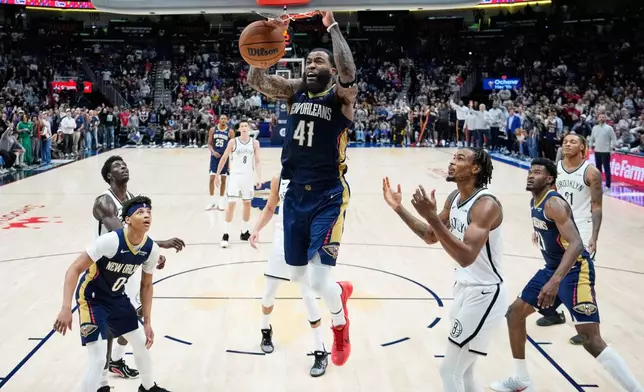 New Orleans Pelicans guard Saddiq Bey (41) slam dunks for the go-ahead basket in the final minute of the second half of an NBA basketball game against the Brooklyn Nets, Wednesday, Jan. 14, 2026, in New Orleans. (AP Photo/Gerald Herbert)