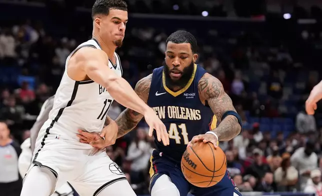 New Orleans Pelicans guard Saddiq Bey (41) battles against Brooklyn Nets forward Michael Porter Jr. (17) in the first half of an NBA basketball game, Wednesday, Jan. 14, 2026, in New Orleans. (AP Photo/Gerald Herbert)
