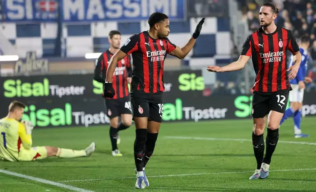 AC Milan's Christopher Nkunku celebrates scoring during the Serie A soccer match between Como and Milan in Como, Italy, Thursday Jan. 15, 2026. (Antonio Saia/LaPresse via AP)