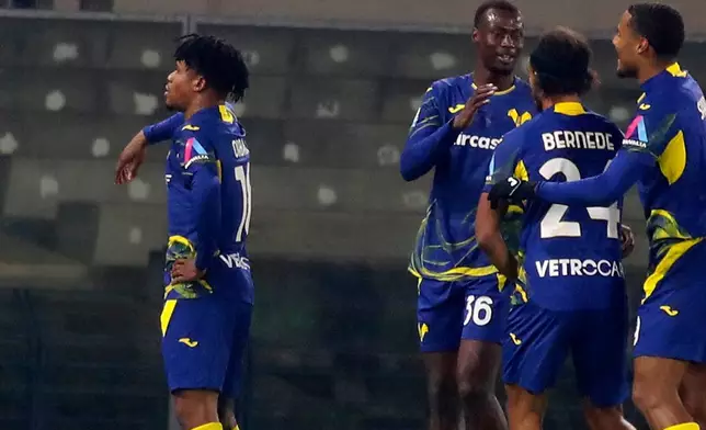 Verona's Gift Orban, left, celebrates scoring during the Serie A soccer match between Hellas Verona and Bologna in Verona, Italy, Thursday Jan. 15 , 2026. (Paola Garbuio/LaPresse via AP)