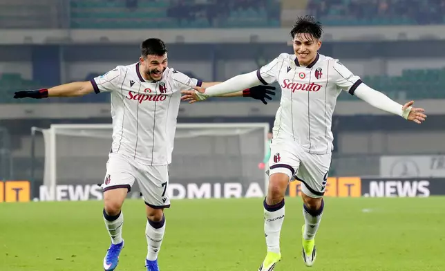 Bologna's Santiago Castro (9), right, celebrates goal 1-3 during the Serie A soccer match between Hellas Verona and Bologna in Verona, Italy, Thursday Jan. 15 , 2026. (Paola Garbuio/LaPresse via AP)
