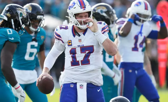 Buffalo Bills quarterback Josh Allen gets up after collecting a first down near the Jacksonville Jaguars end zone later in the second half of an NFL wild-card playoff football game Sunday, Jan. 11, 2026, in Jacksonville, Fla. (AP Photo/Chris O'Meara)