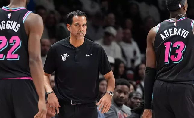 Miami Heat head coach Erik Spoelstra watches from courtside during the first half of an NBA basketball game against the Boston Celtics, Thursday, Jan. 15, 2026, in Miami. (AP Photo/Rebecca Blackwell)