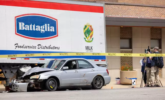 FILE - Law enforcement personnel investigate after the Department of Homeland Security said an Immigration and Customs Enforcement agent fatally shot a man in the Franklin Park suburb of Chicago on Sept. 12, 2025. (Candace Dane Chambers/Chicago Sun-Times via AP, File)