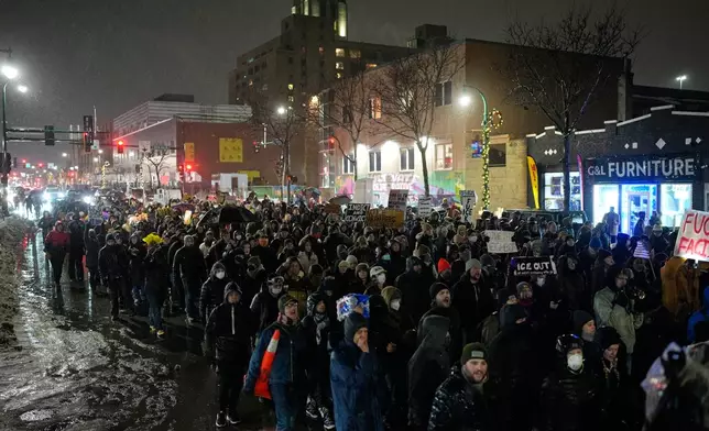 Protesters chant and march during a rally for Renee Good, who was fatally shot by an ICE officer the day before, Thursday, Jan. 8, 2026, in Minneapolis. (AP Photo/John Locher)